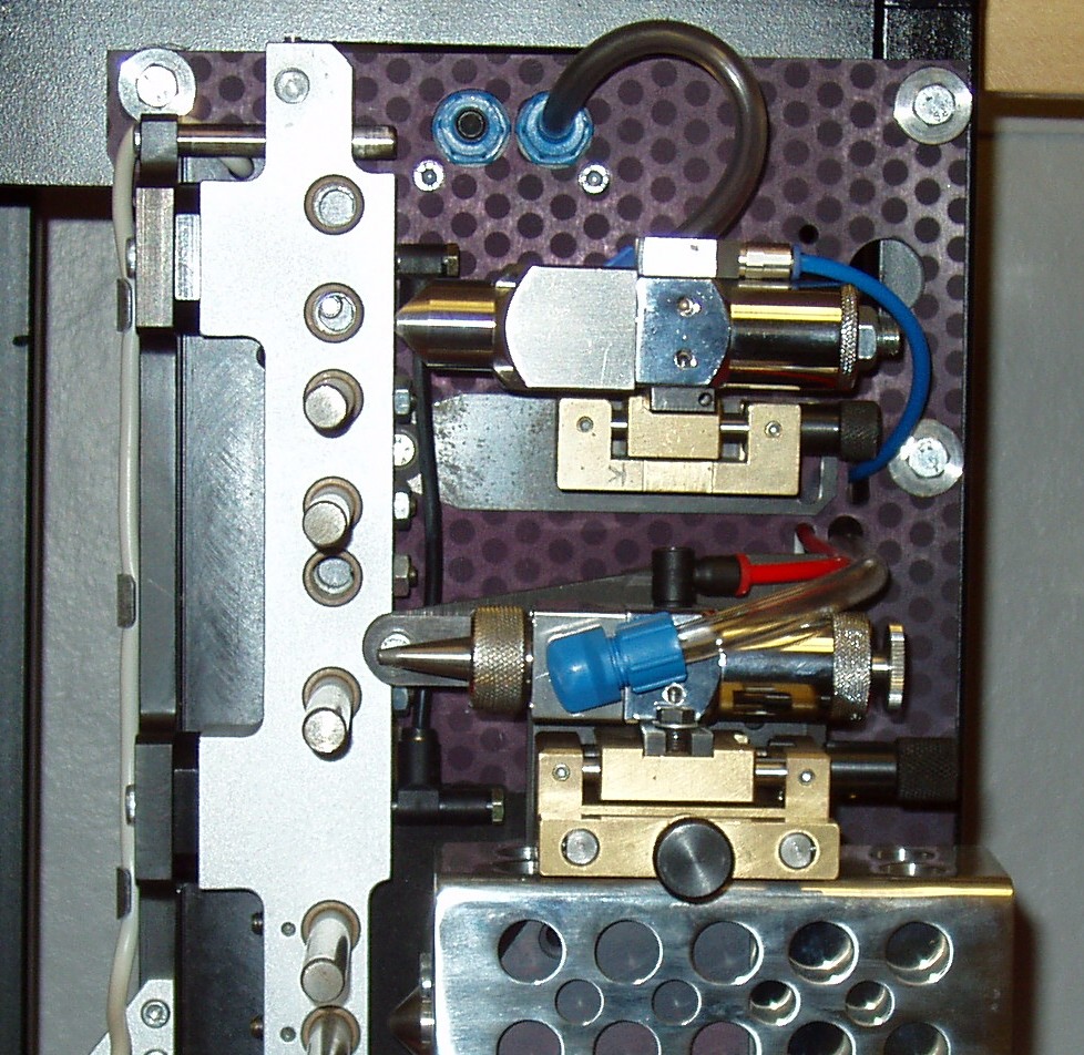 Gravity Fed Hotmelt system backplate with hot melt applicator, supplementary PVA and tow retention lines.